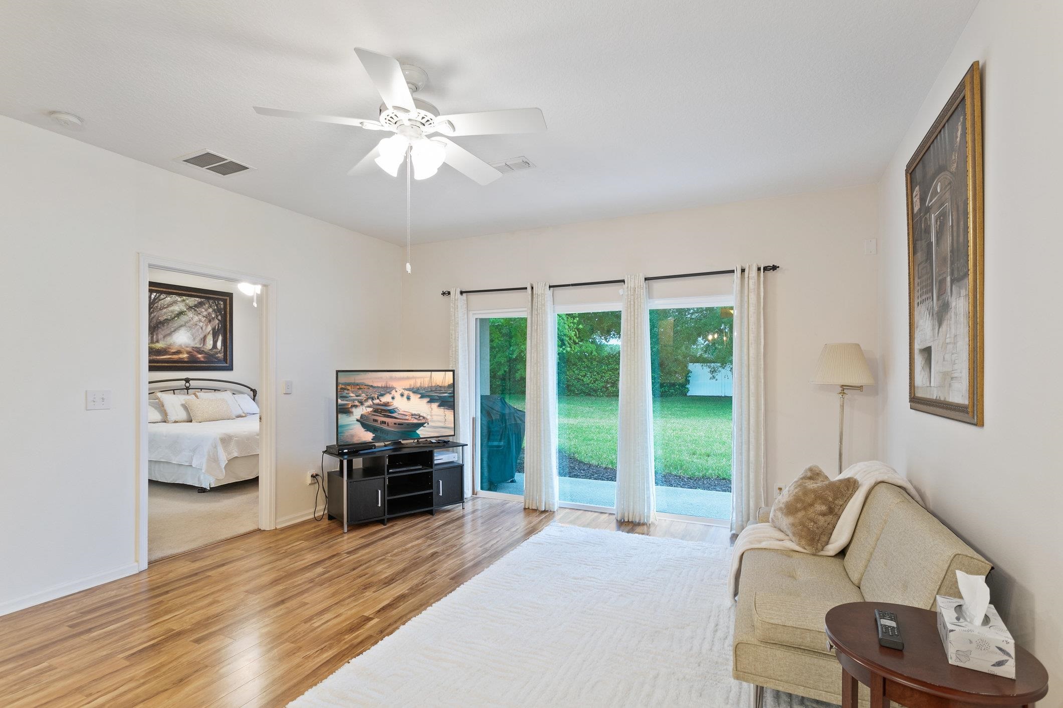 554 Wooded Crossing Circle St. Augustine, FL 32084 - Photo 17 of 43 a living room with furniture and a large window