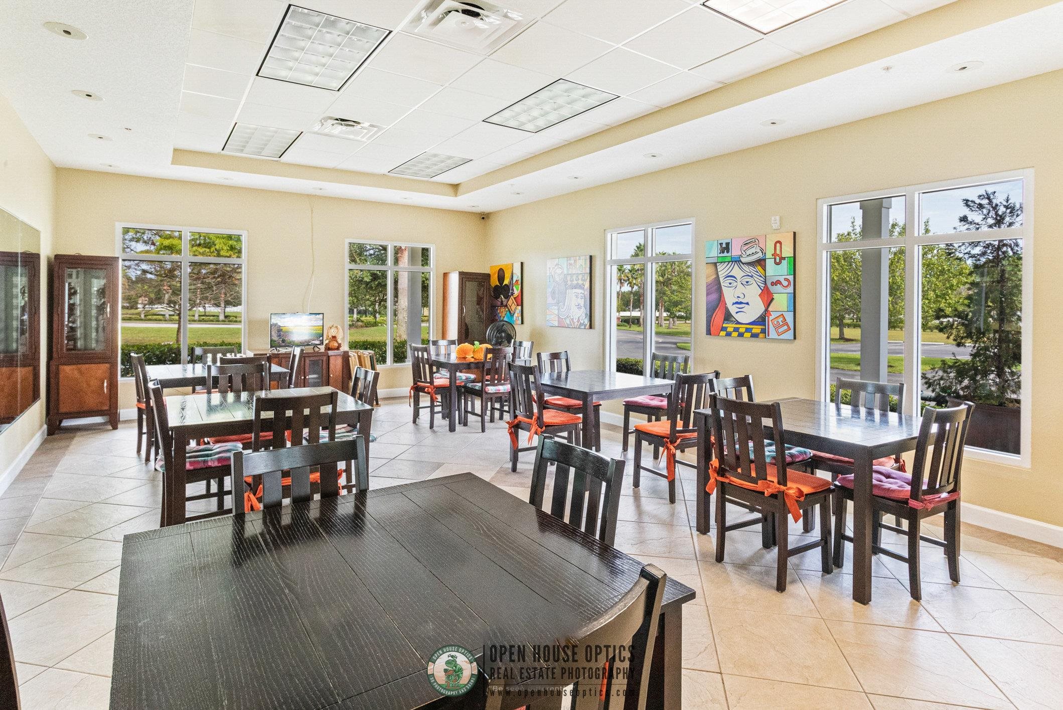 554 Wooded Crossing Circle St. Augustine, FL 32084 - Photo 37 of 43 a dining room with lots of tables and chairs