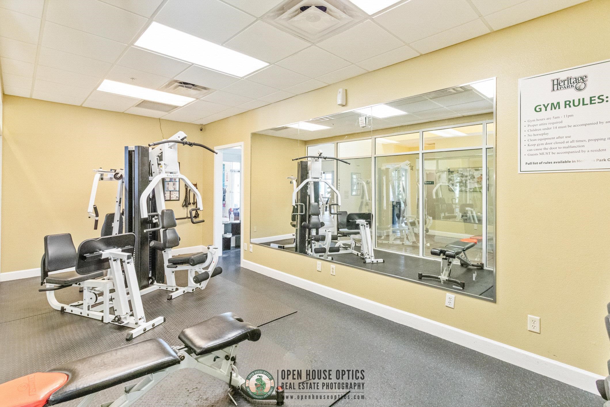 554 Wooded Crossing Circle St. Augustine, FL 32084 - Photo 40 of 43 a room with lots of white furniture and glass door