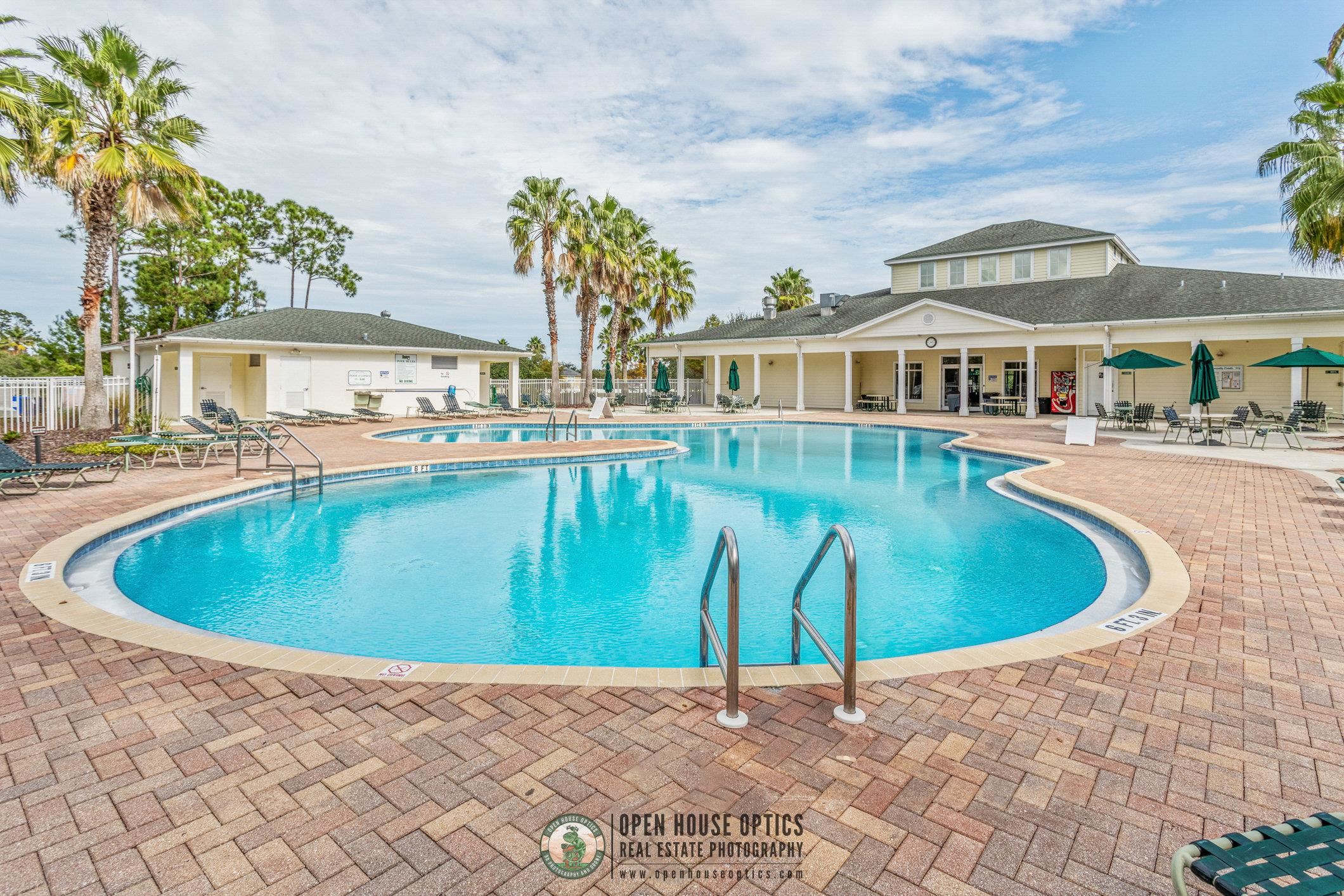 554 Wooded Crossing Circle St. Augustine, FL 32084 - Photo 42 of 43 a view of a swimming pool with a patio