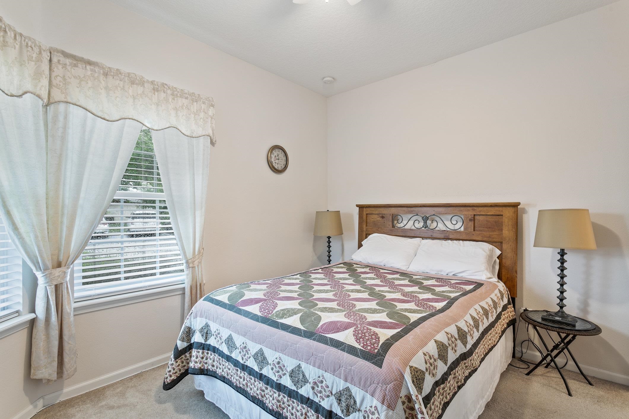 554 Wooded Crossing Circle St. Augustine, FL 32084 - Photo 8 of 43 a bedroom with a bed and a window in it