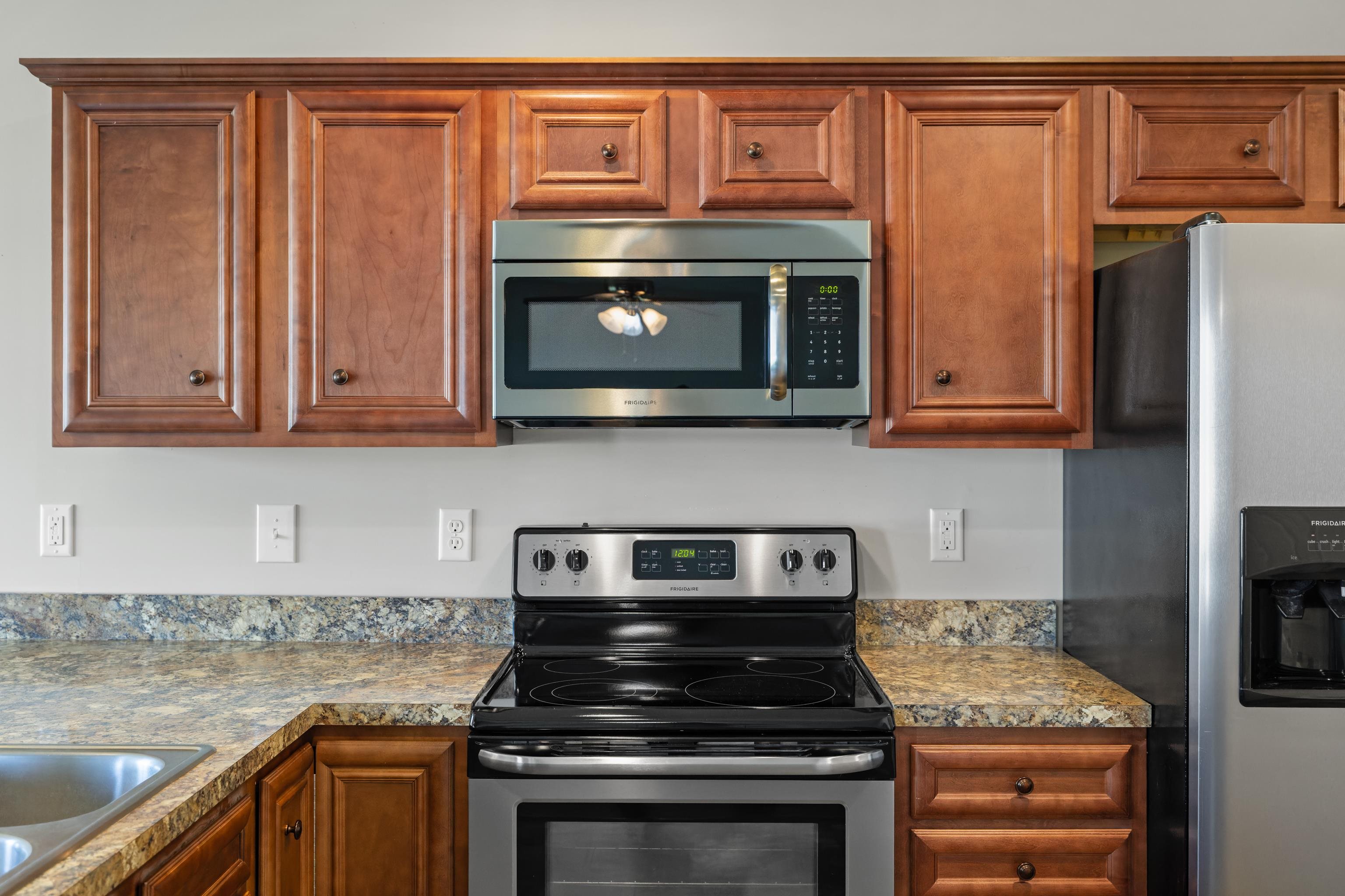 3365 Legion Way Broadway, VA 22815 - Photo 11 of 69 a kitchen with stainless steel appliances granite countertop a stove microwave and refrigerator