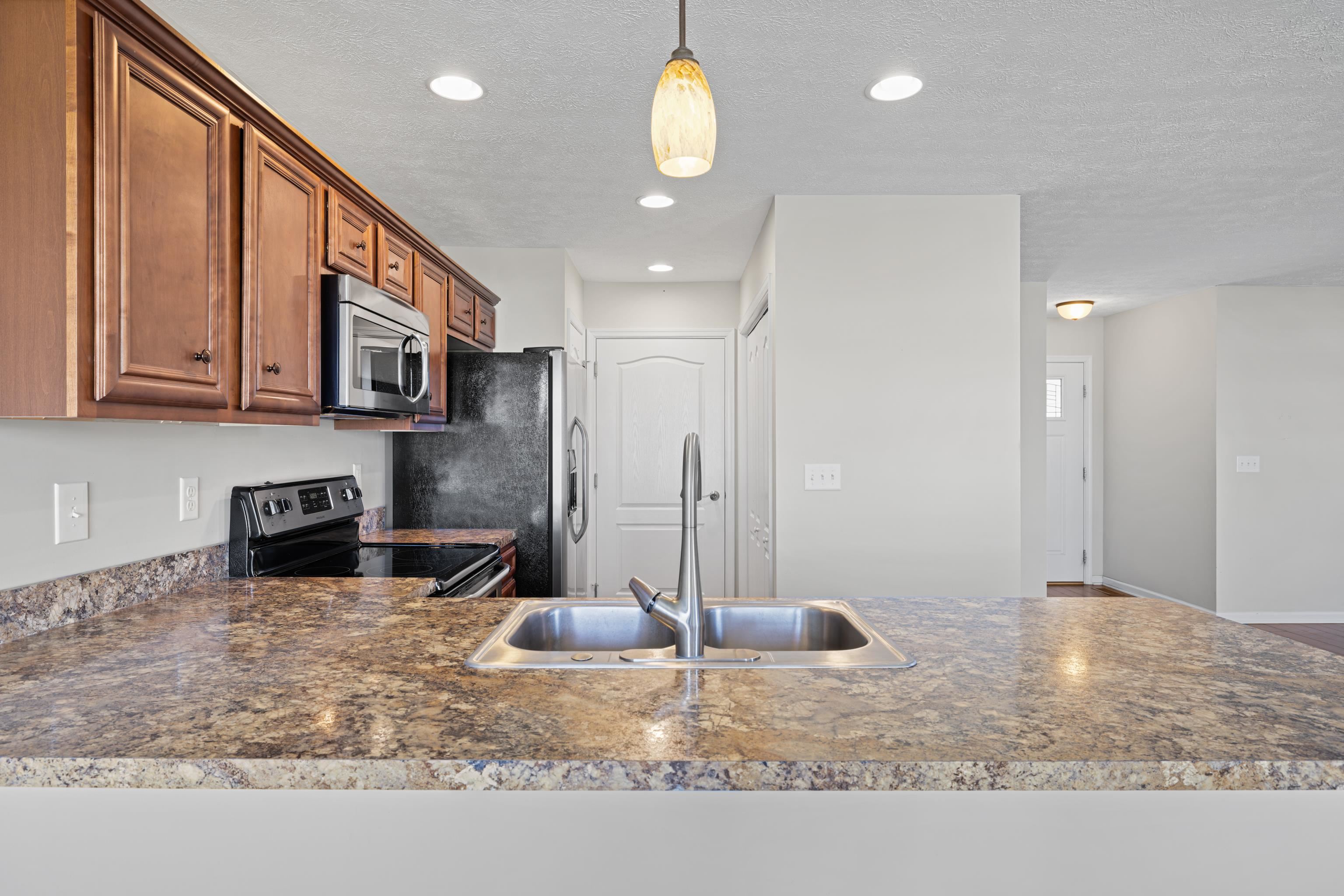 3365 Legion Way Broadway, VA 22815 - Photo 18 of 69 a kitchen with stainless steel appliances granite countertop a sink a stove and a refrigerator