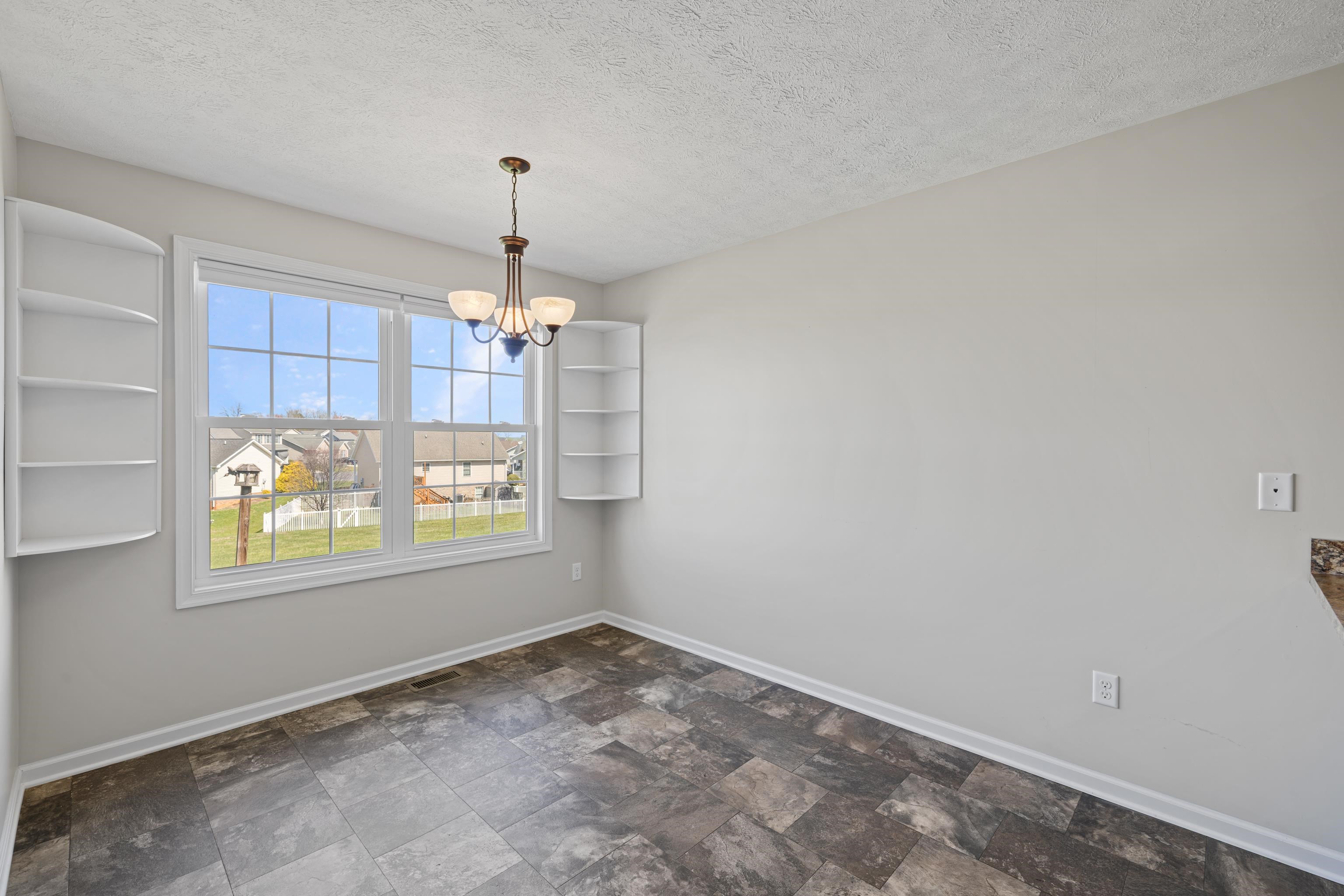 3365 Legion Way Broadway, VA 22815 - Photo 22 of 69 an empty room with windows and chandelier fan