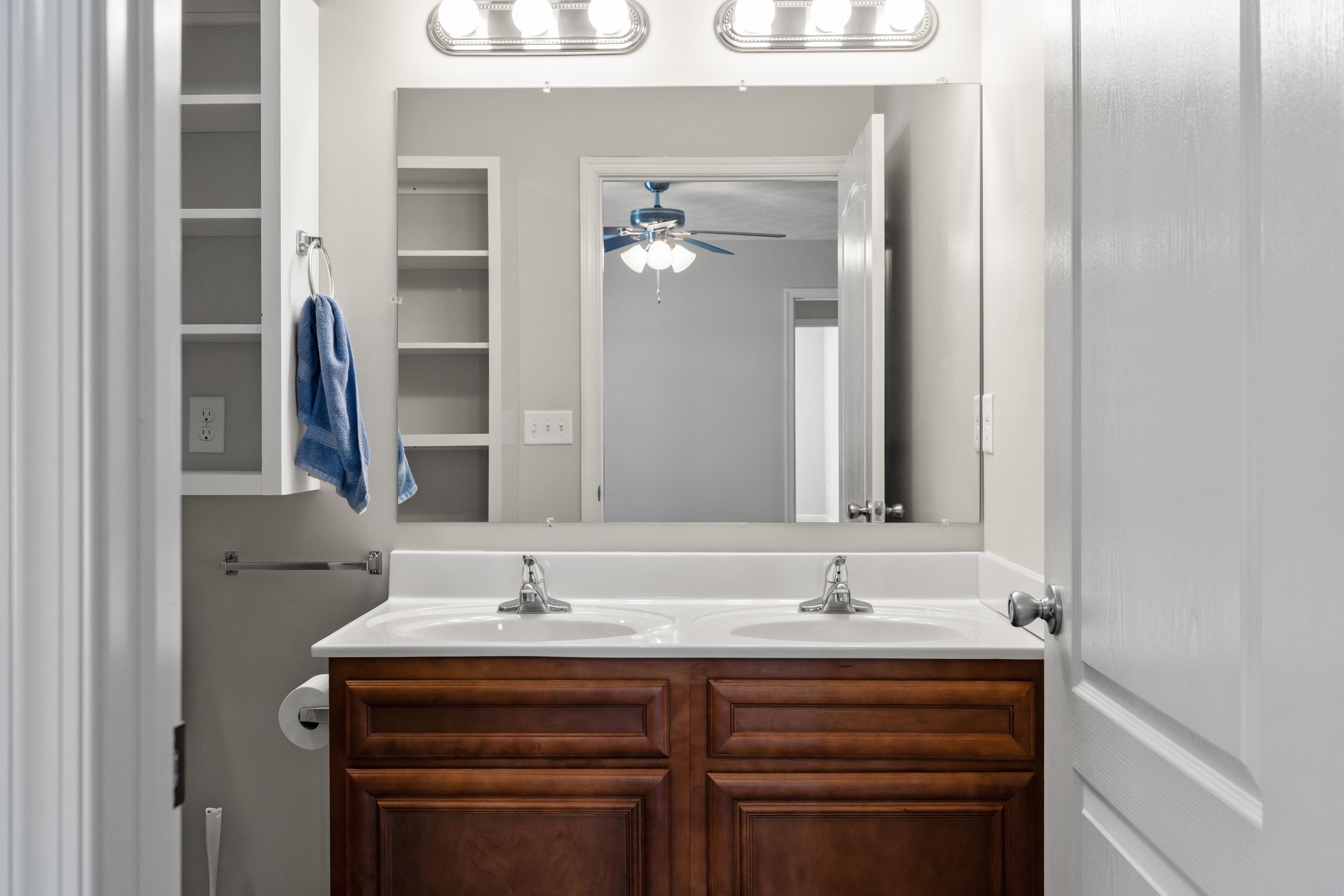 3365 Legion Way Broadway, VA 22815 - Photo 26 of 69 a bathroom with a granite countertop sink and a mirror