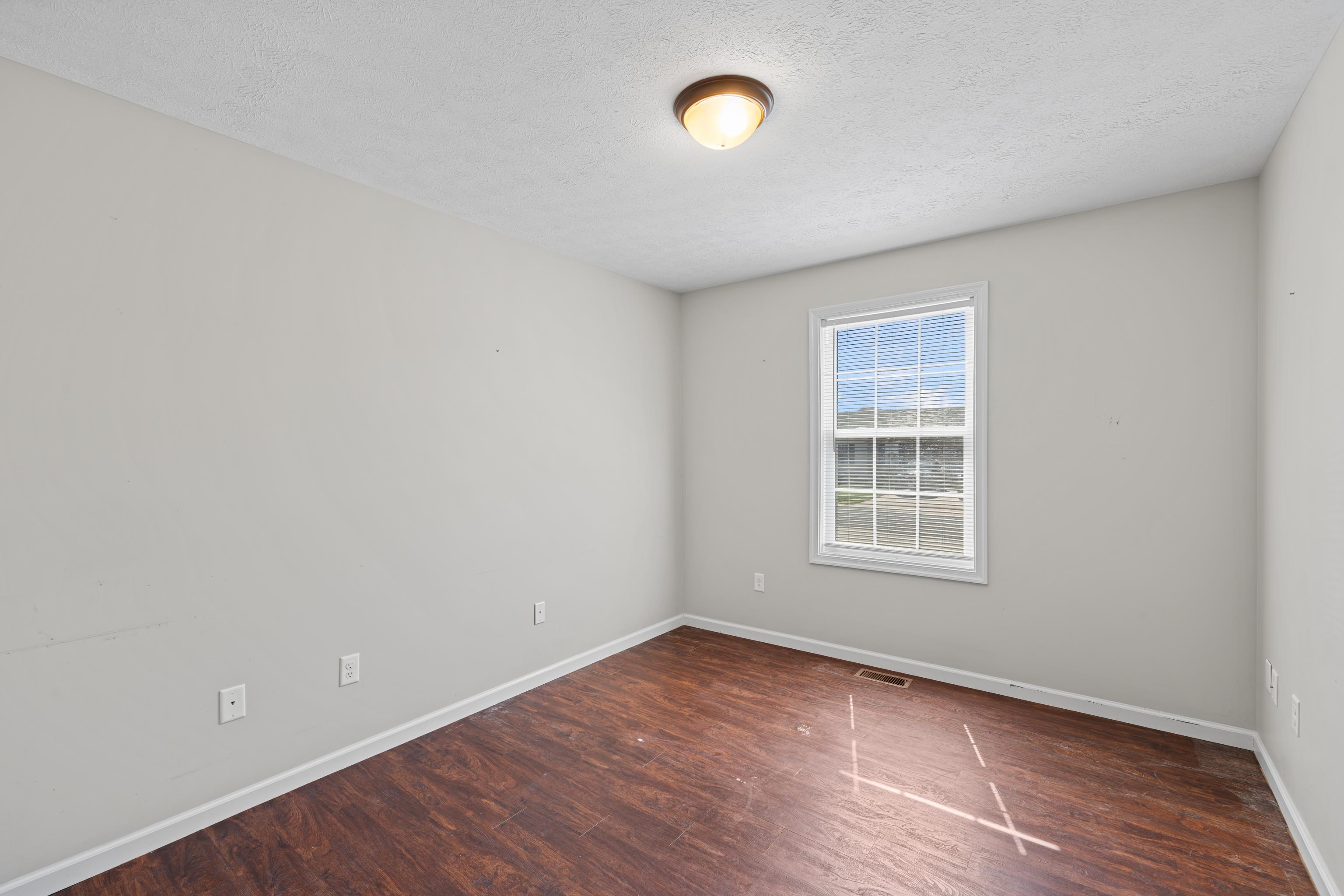 3365 Legion Way Broadway, VA 22815 - Photo 35 of 69 an empty room with wooden floor and windows