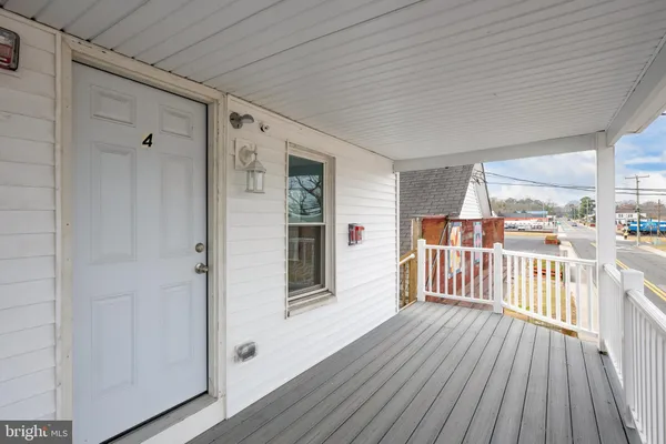 a view of a balcony with wooden floor