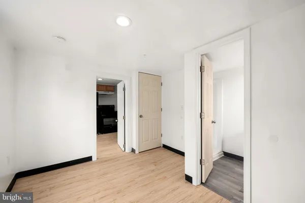 a view of hallway with wooden floor