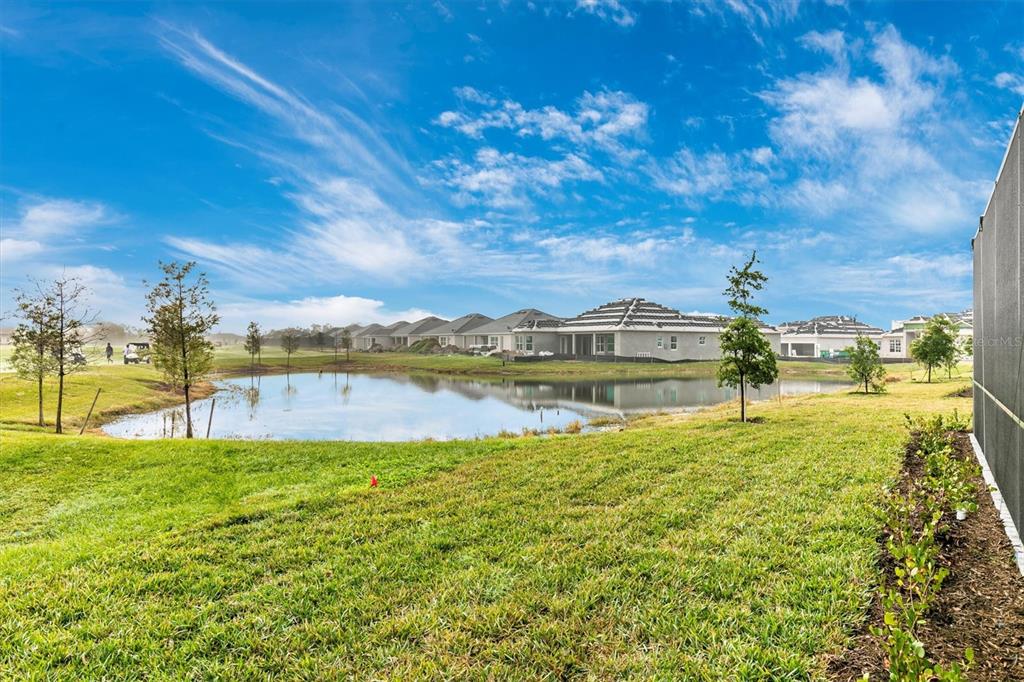 12736 Tulum Loop Venice, FL 34293 - Photo 60 of 100 a view of a lake with houses in the back