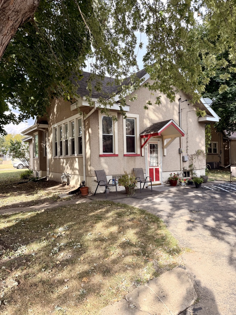 329 West Devlin Street Spring Valley, IL 61362 - Photo 2 of 11 a view of a white house with a large tree