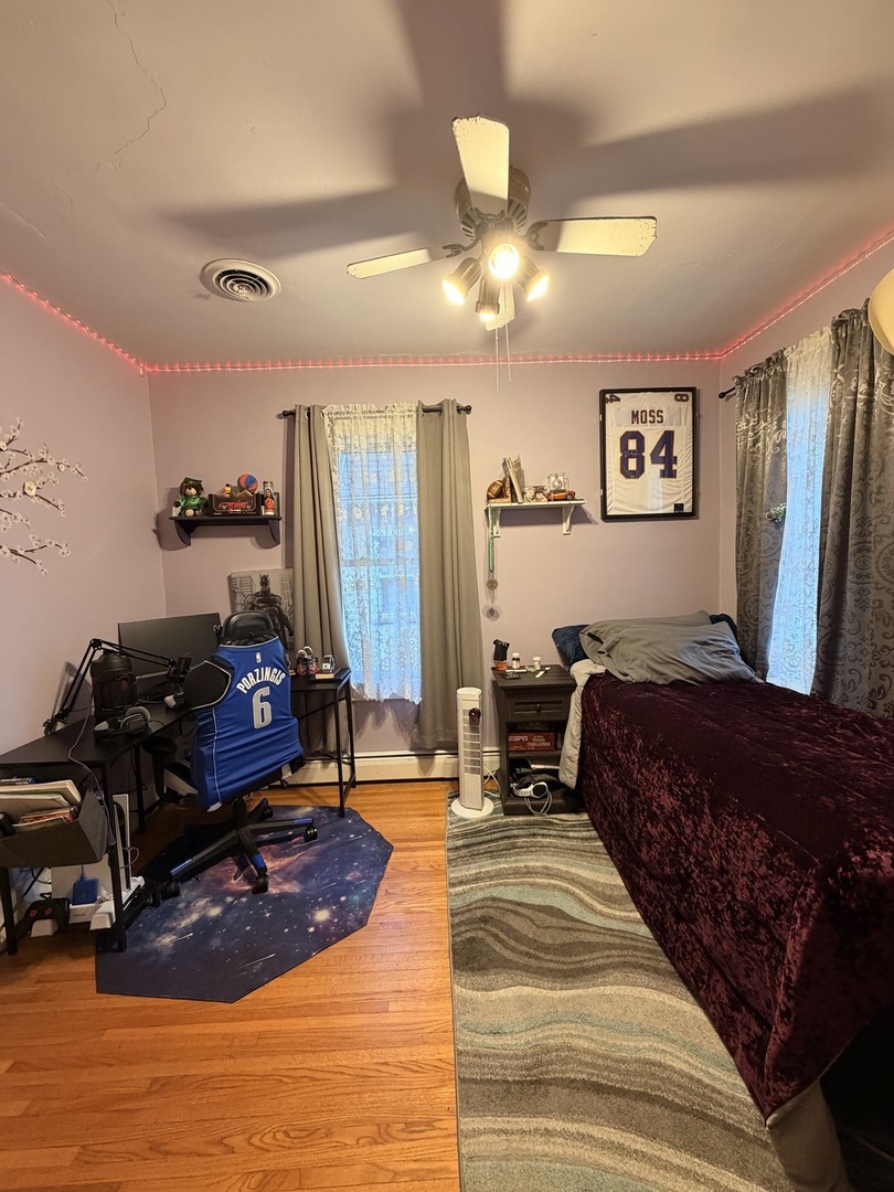 329 West Devlin Street Spring Valley, IL 61362 - Photo 9 of 11 a bed room with a bed mirror and a window