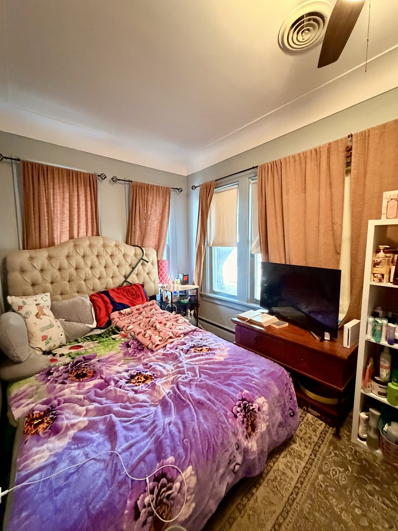 329 West Devlin Street Spring Valley, IL 61362 - Photo 10 of 11 a bedroom with a bed and flat screen tv