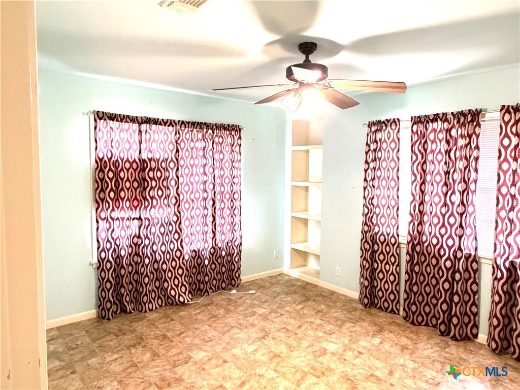 1902 Navidad Street Victoria, TX 77901 - Photo 19 of 23 a view of entryway with a window and a ceiling fan