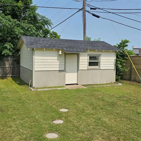 a house that has a tree in front of it