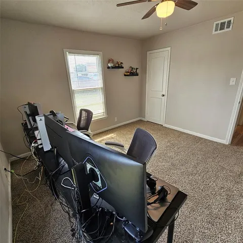 a front view of a house with a garden and yard
