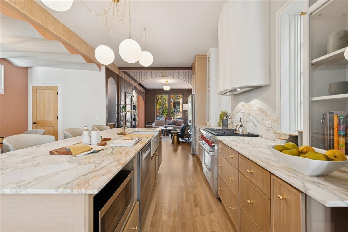 2337 West Belden Avenue Chicago, IL 60647 - Photo 11 of 53 a large kitchen with a stove and a sink