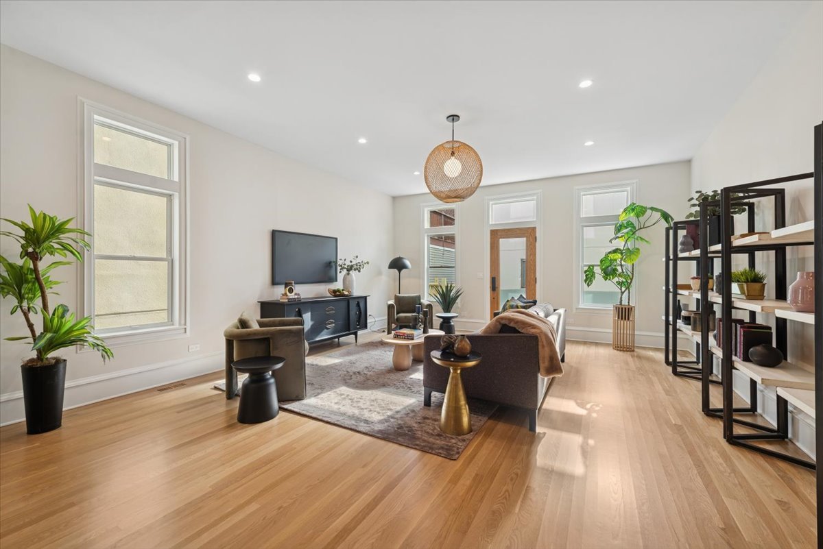 2337 West Belden Avenue Chicago, IL 60647 - Photo 12 of 53 a living room with furniture and a flat screen tv