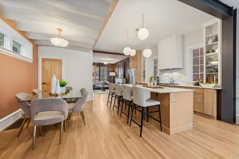 a dining room with furniture and window