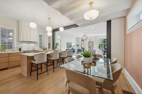 a kitchen with a table and chairs in it