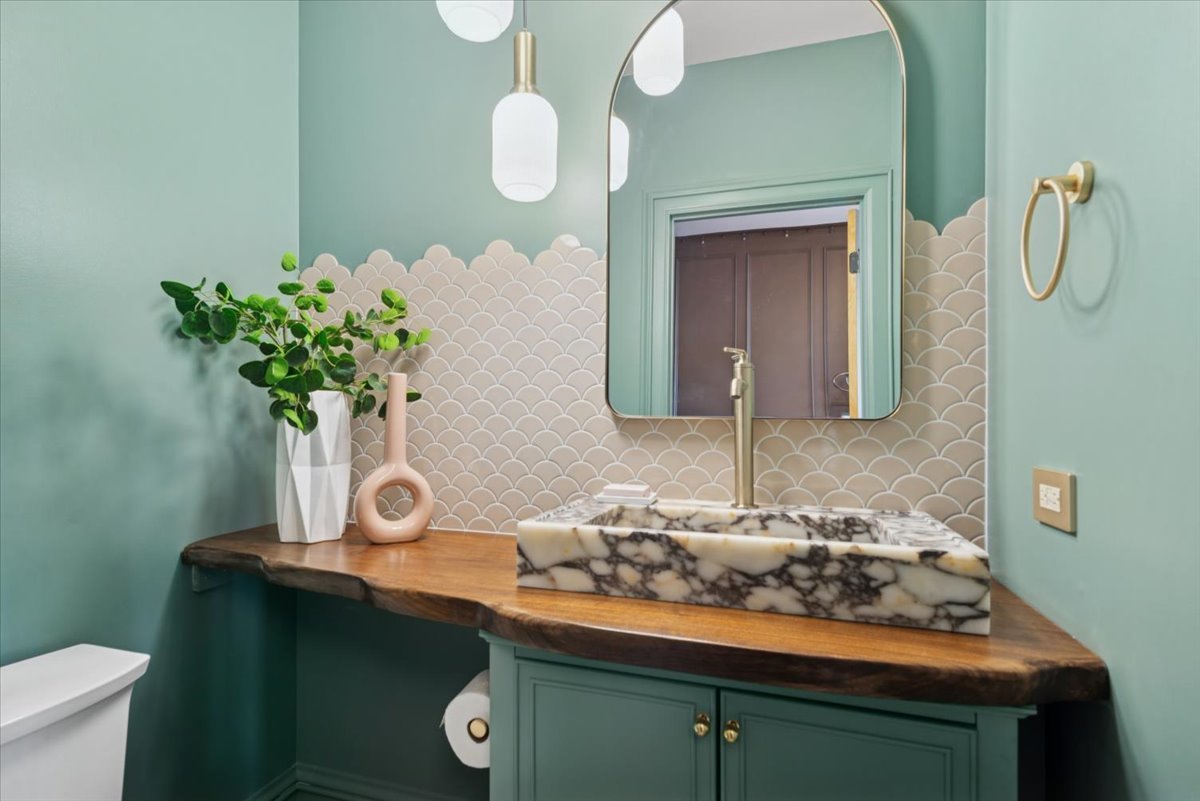 2337 West Belden Avenue Chicago, IL 60647 - Photo 24 of 53 a bathroom with a sink and a mirror