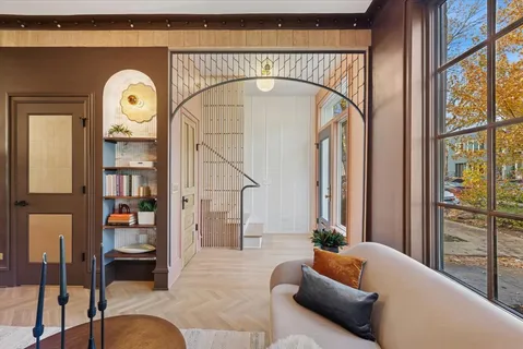 a view of entryway with wooden floor and windows