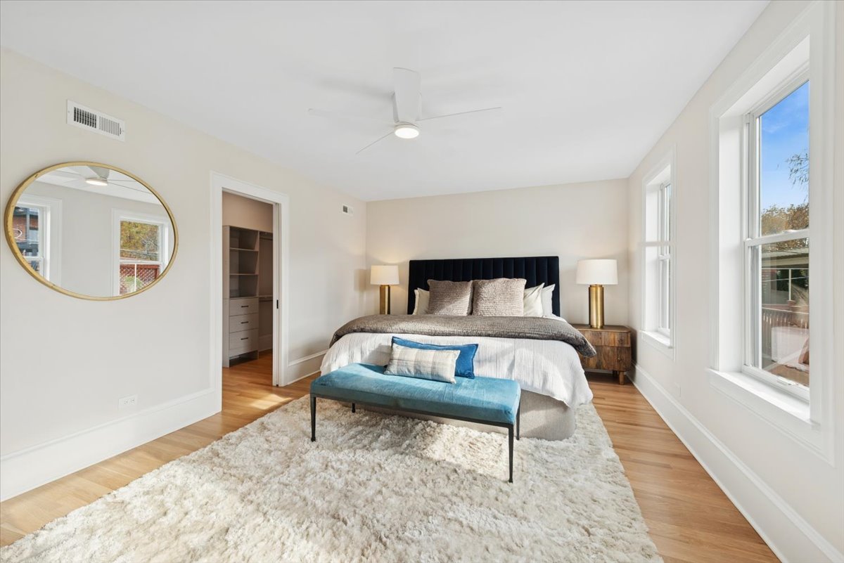 2337 West Belden Avenue Chicago, IL 60647 - Photo 32 of 53 a bedroom with a bed and a mirror