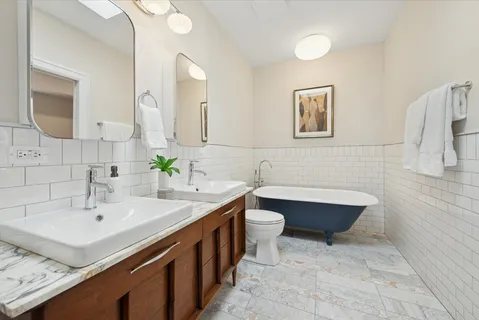 a view of a hallway with washer and dryer