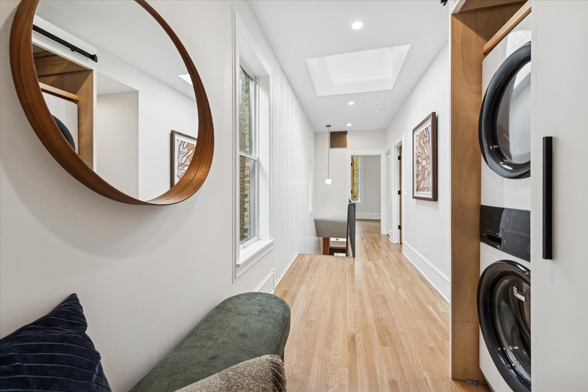 2337 West Belden Avenue Chicago, IL 60647 - Photo 37 of 53 a view of a hallway with washer and dryer