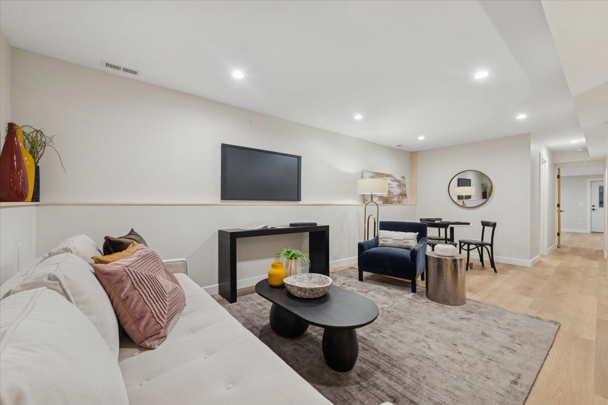2337 West Belden Avenue Chicago, IL 60647 - Photo 42 of 53 a living room with furniture and a fireplace