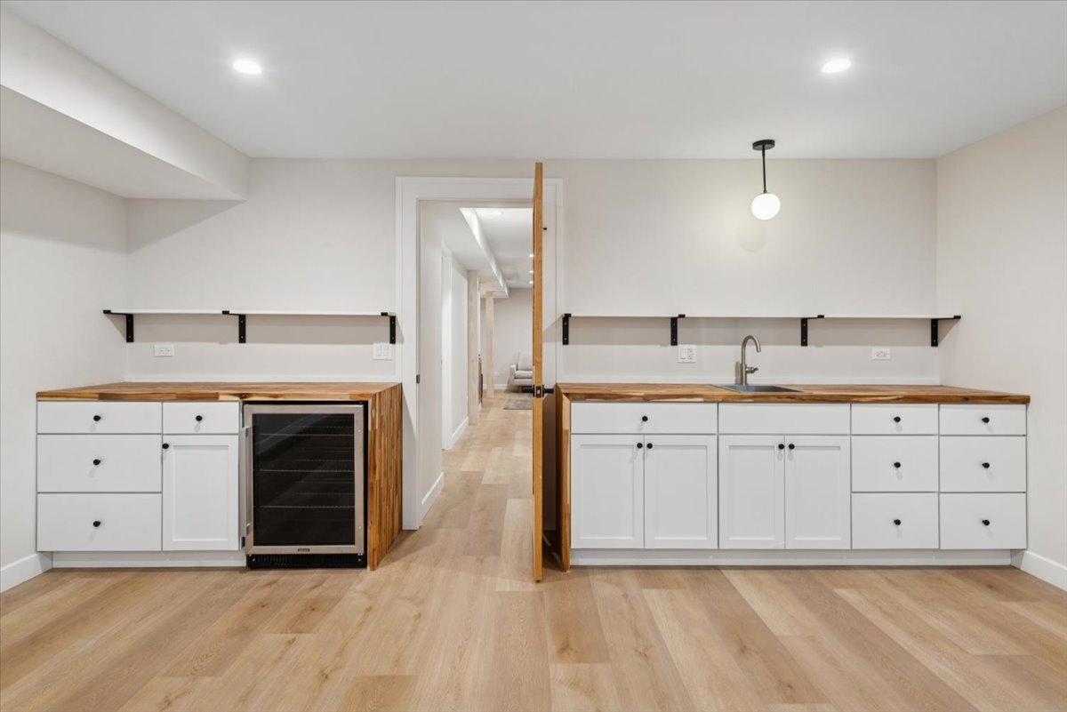 2337 West Belden Avenue Chicago, IL 60647 - Photo 49 of 53 a kitchen with a sink cabinets and wooden floor