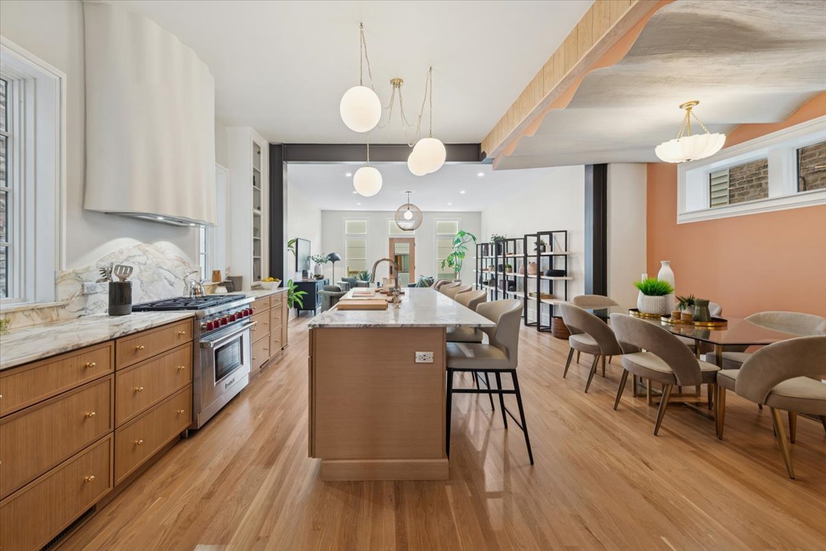2337 West Belden Avenue Chicago, IL 60647 - Photo 6 of 53 a large kitchen with lots of counter space dining table and chairs