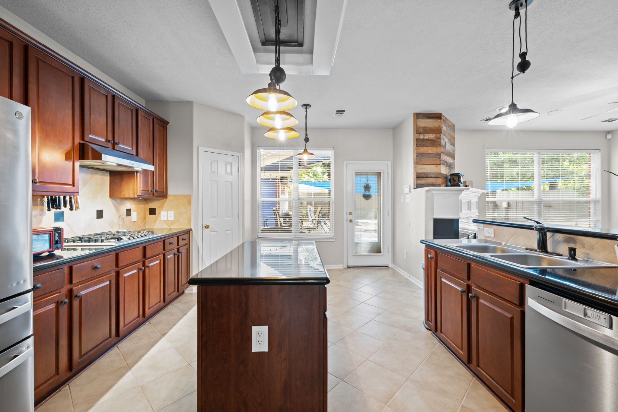19114 Emory Trail Spring, TX 77388 - Photo 17 of 44 a open kitchen with stainless steel appliances granite countertop a sink stove and refrigerator