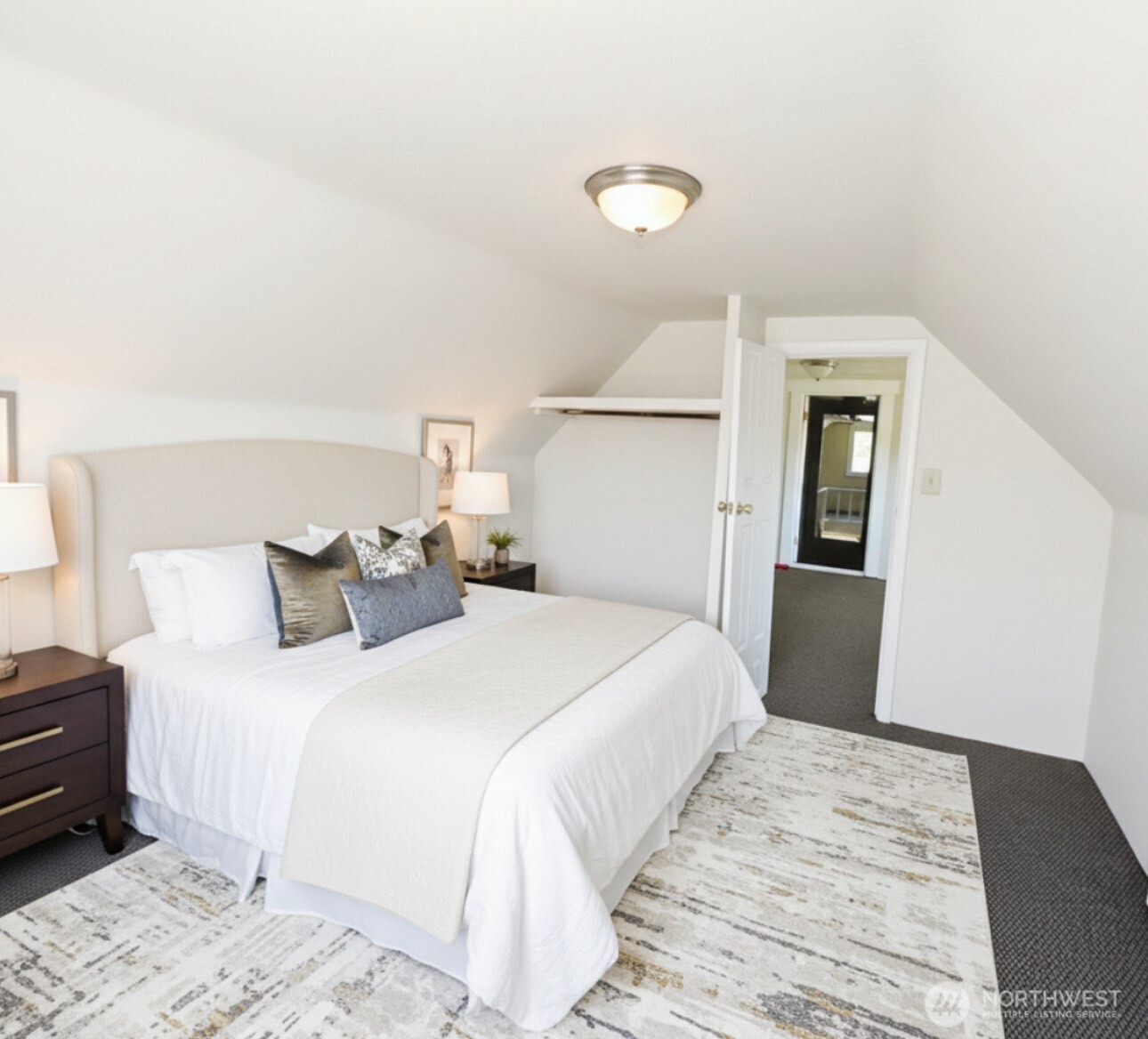 1202 West Perry Street Aberdeen, WA 98520 - Photo 18 of 35 a bedroom with a bed and a mirror