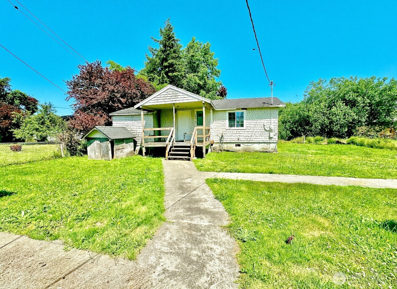 1202 West Perry Street Aberdeen, WA 98520 - Photo 21 of 35 a view of a house with a yard