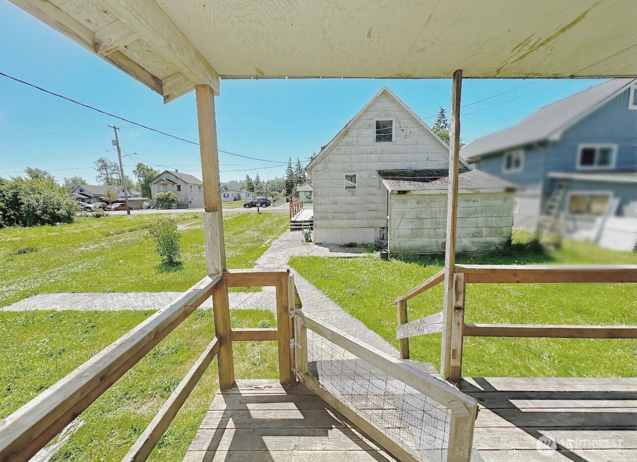 1202 West Perry Street Aberdeen, WA 98520 - Photo 23 of 35 a view of deck with a flat tv screen and a big yard