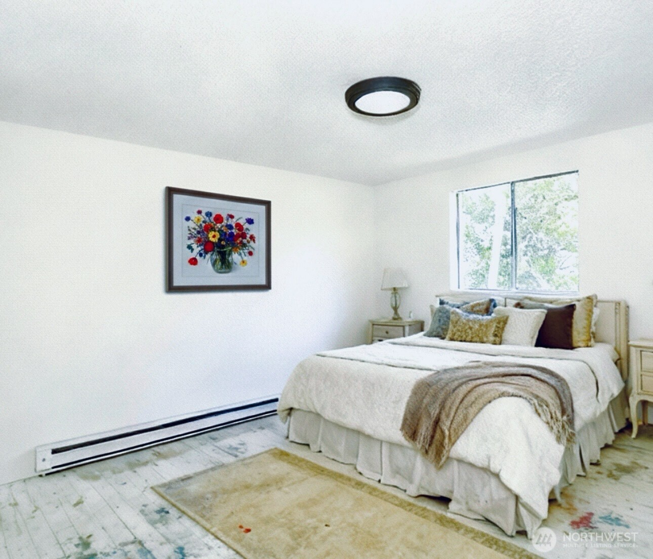 1202 West Perry Street Aberdeen, WA 98520 - Photo 29 of 35 a bedroom with a bed and a painting on the wall