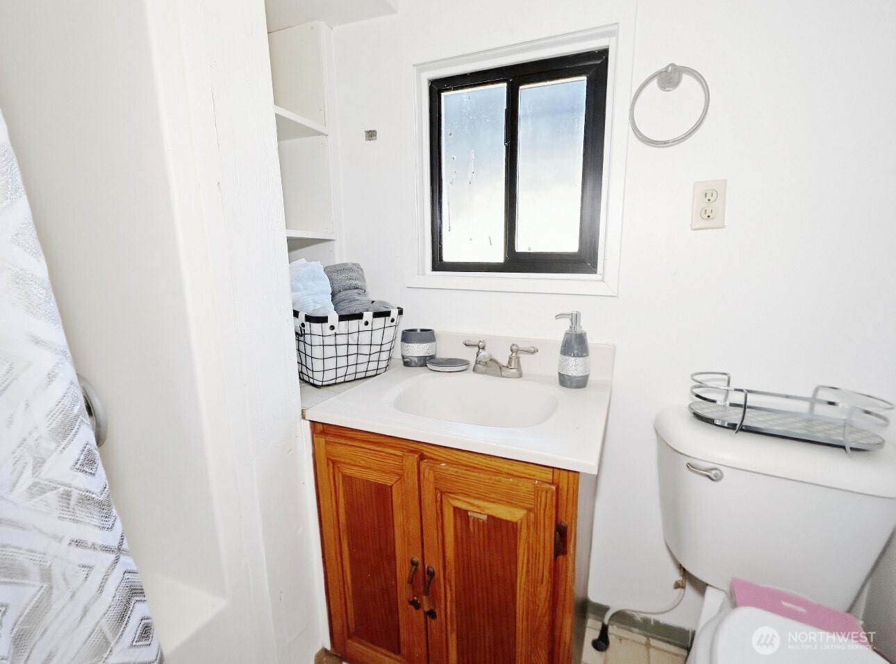 1202 West Perry Street Aberdeen, WA 98520 - Photo 9 of 35 a bathroom with a sink vanity mirror and toilet
