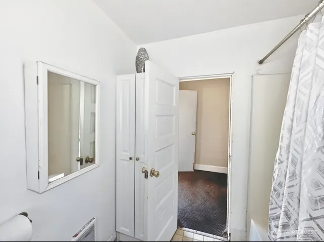 a view of a bathroom from a hallway
