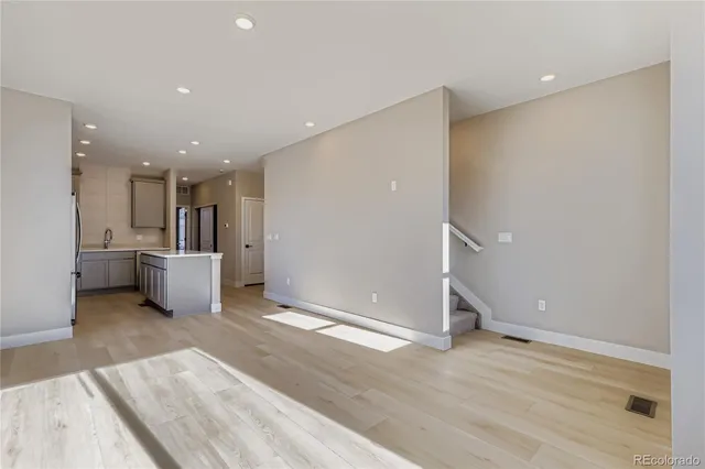 a view of a kitchen with a sink and a window