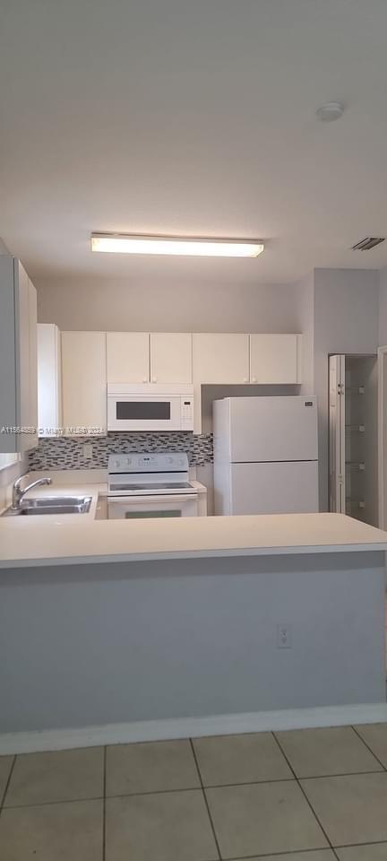 4941 Southwest 135th Way Miramar, FL 33027 - Photo 11 of 11 a view of kitchen with sink