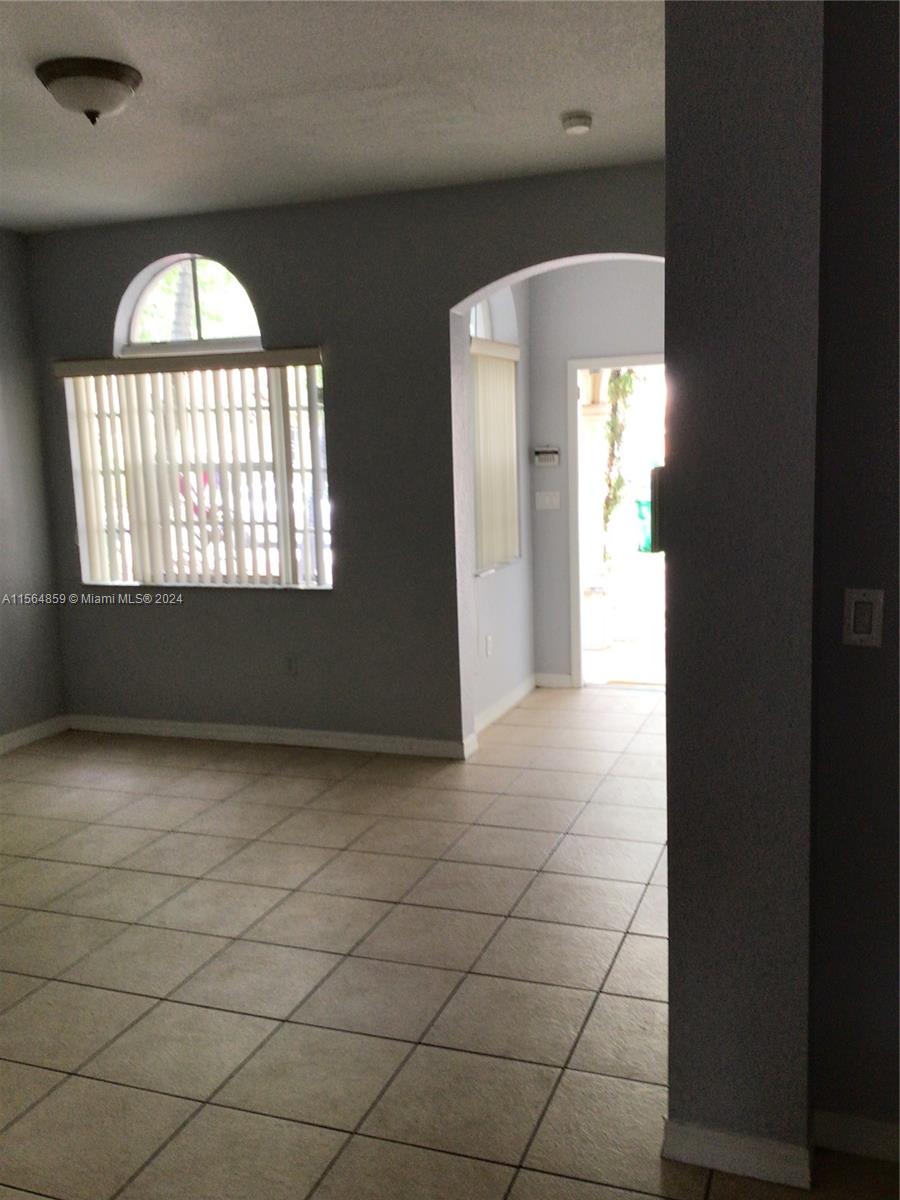 4941 Southwest 135th Way Miramar, FL 33027 - Photo 2 of 11 an empty room with window