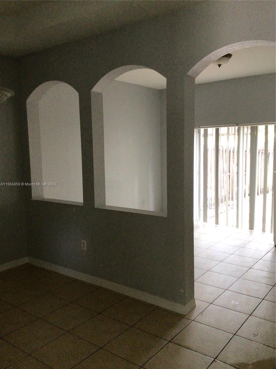 4941 Southwest 135th Way Miramar, FL 33027 - Photo 3 of 11 a view of an empty room with a window