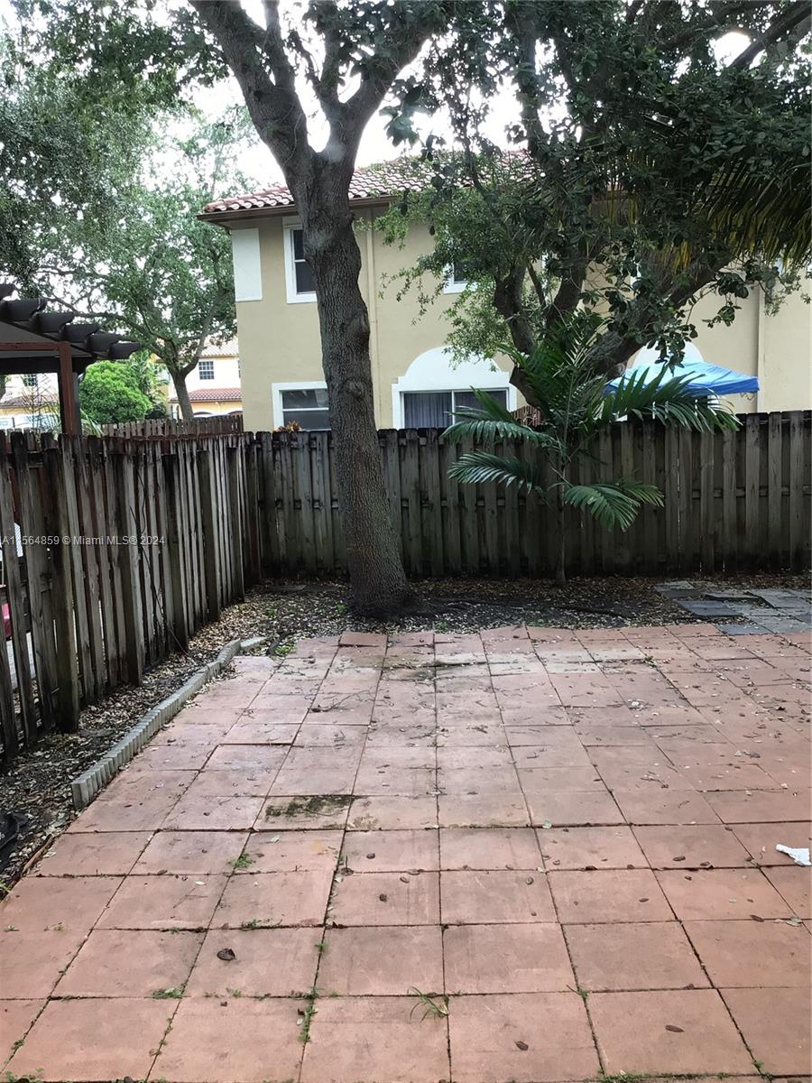 4941 Southwest 135th Way Miramar, FL 33027 - Photo 9 of 11 a view of a yard