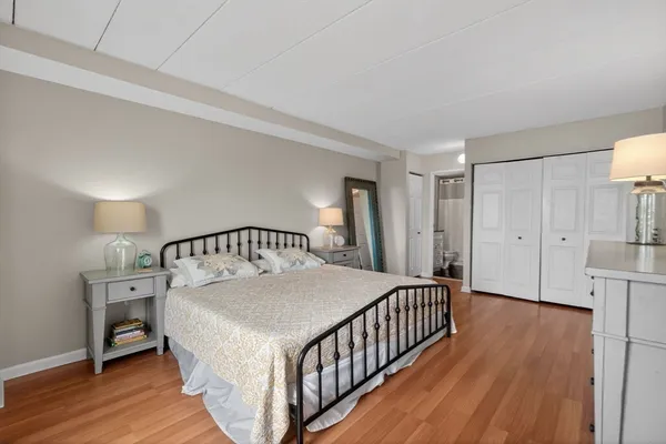a bedroom with a bed and a view of bedroom