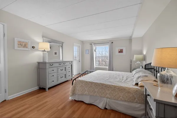 a bedroom with a bed and a closet