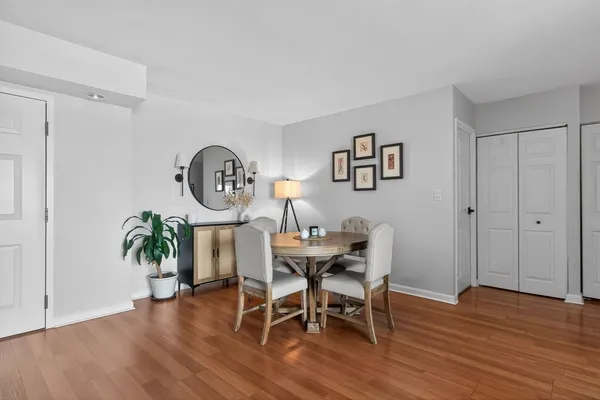a view of a dining room with furniture and wooden floor