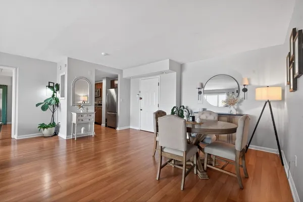 a view of a dining room with furniture and wooden floor