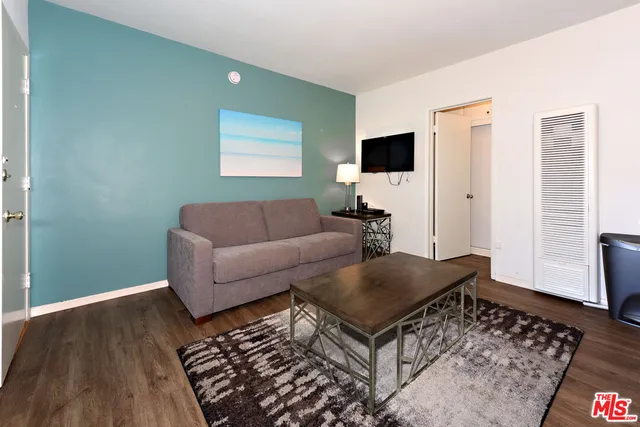 a living room with furniture and a rug