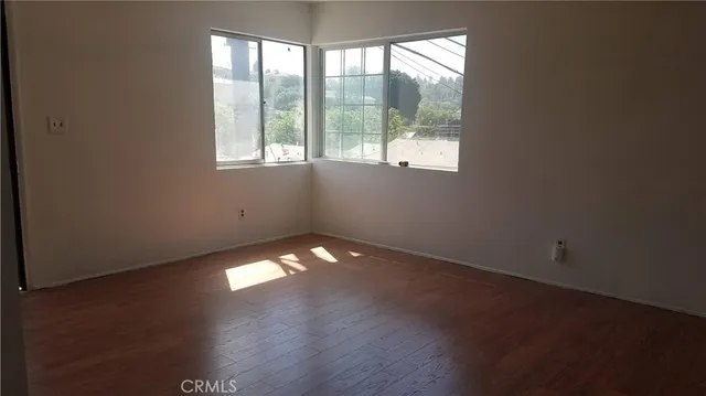 a bathroom with a toilet and a bath tub
