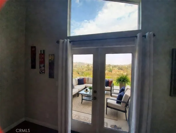 a view of living room and hardwood floor